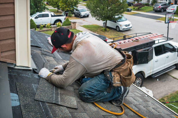 Professional Roofing technician working in Plush, OR